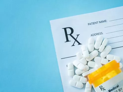 Prescription bottle with prescription pad